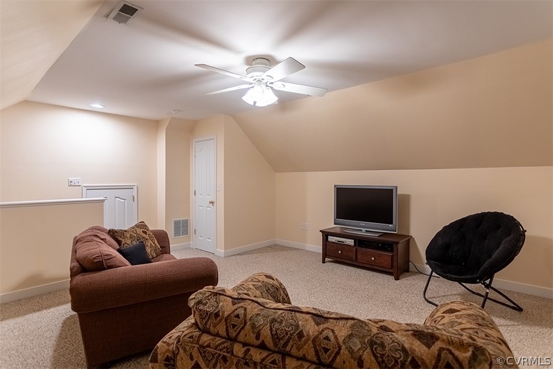 14006 Planters Walk Drive Midlothian, VA 23113 - Photo 34 of 48 a living room with furniture a ceiling fan and a rug