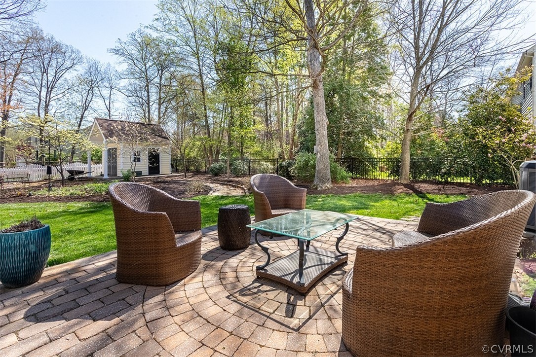 14006 Planters Walk Drive Midlothian, VA 23113 - Photo 37 of 48 a view of a patio with table and chairs and a barbeque