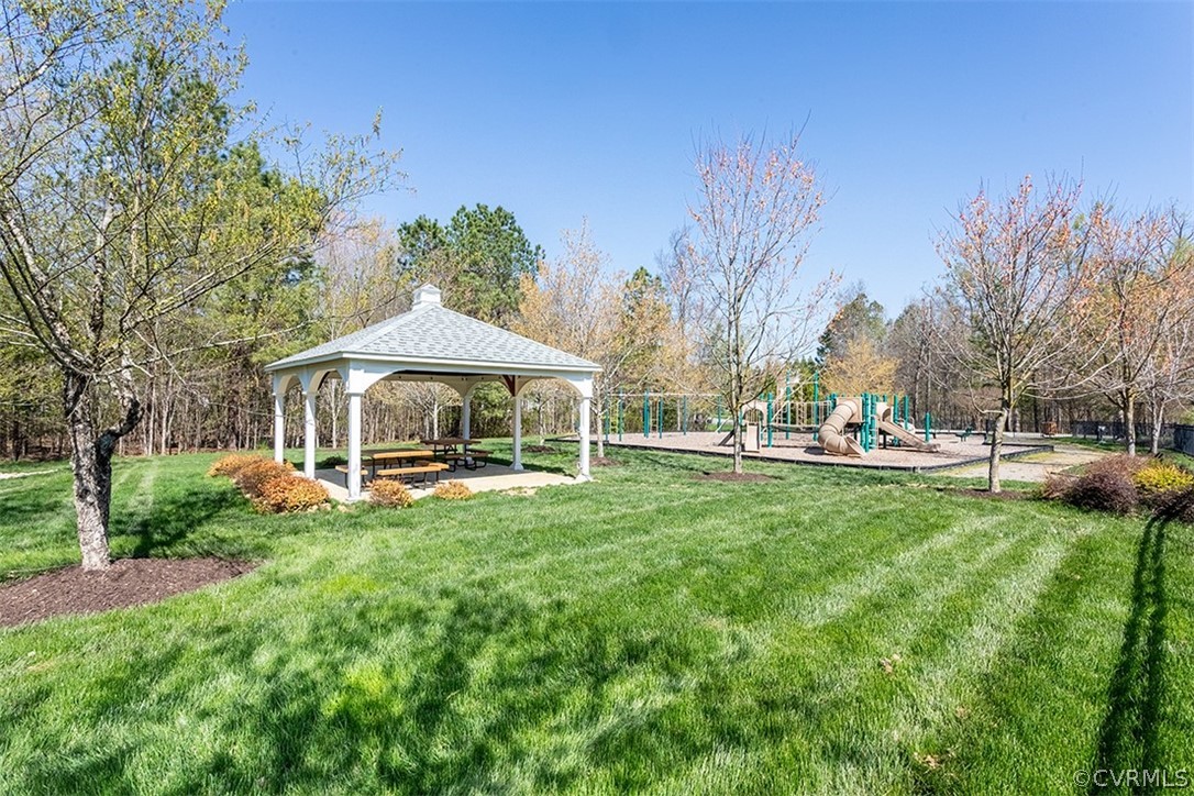 14006 Planters Walk Drive Midlothian, VA 23113 - Photo 43 of 48 a view of a house with backyard sitting area and garden