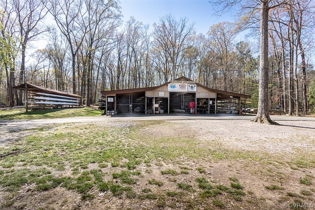 14006 Planters Walk Drive Midlothian, VA 23113 - Photo 46 of 48 a view of a house with a yard covered with snow and trees