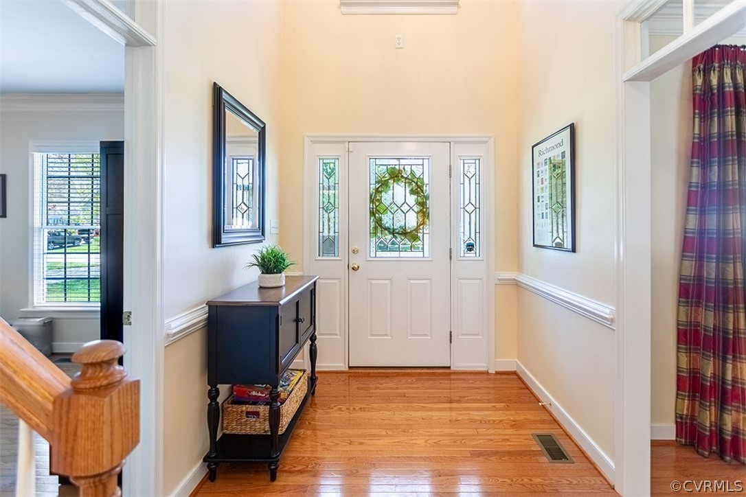 14006 Planters Walk Drive Midlothian, VA 23113 - Photo 7 of 48 a view of an entryway with wooden floor and windows