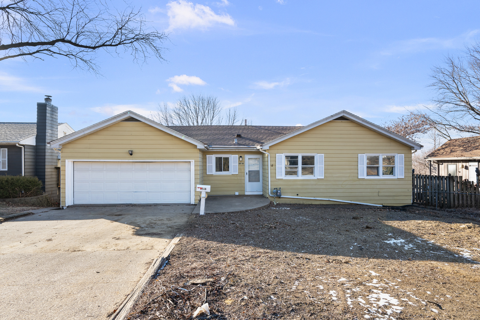 2518 13th Street Rock Island, IL 61201 - Photo 1 of 37 a front view of a house with a yard and garage