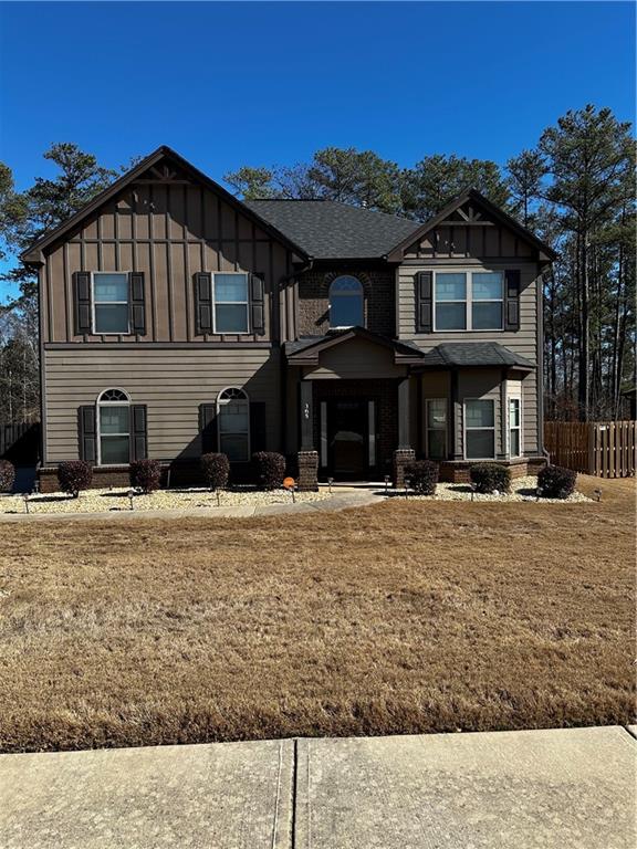 a front view of a house with a yard