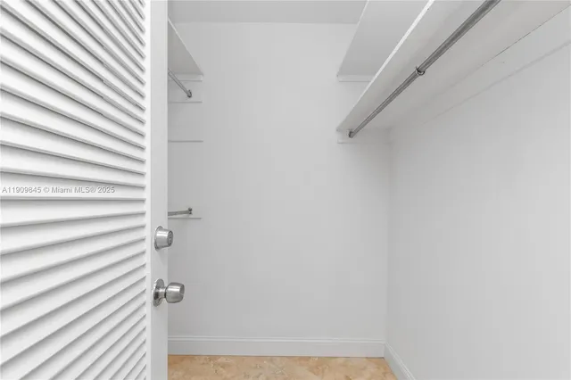 a bathroom with a granite countertop bathtub shower sink and toilet