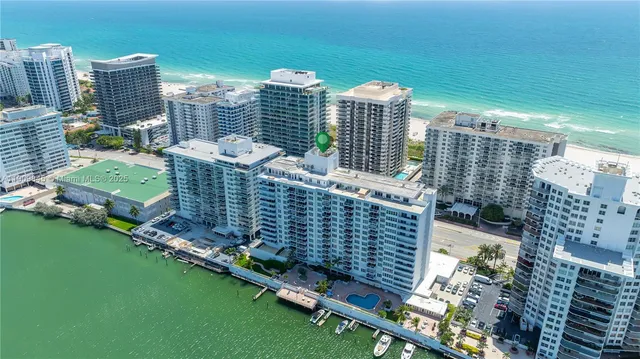 an aerial view of a city with lake view