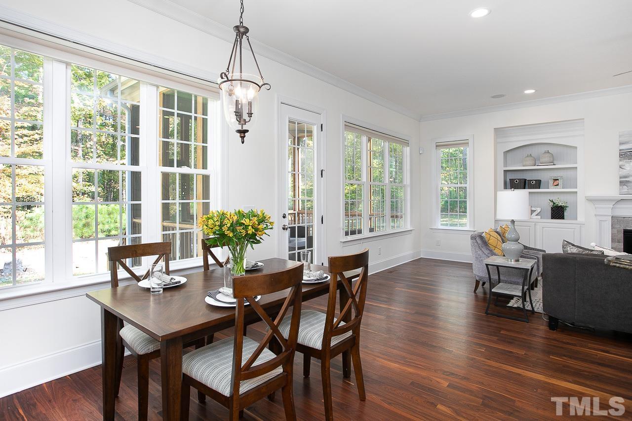 8087 Wake Road Durham, NC 27713 - Photo 13 of 30 a dining room with furniture window wooden floor