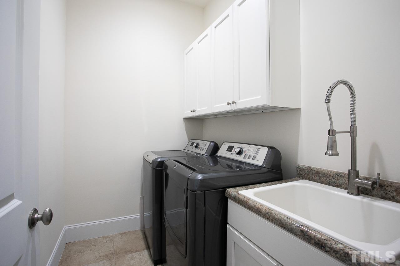 8087 Wake Road Durham, NC 27713 - Photo 21 of 30 a utility room with dryer and washer