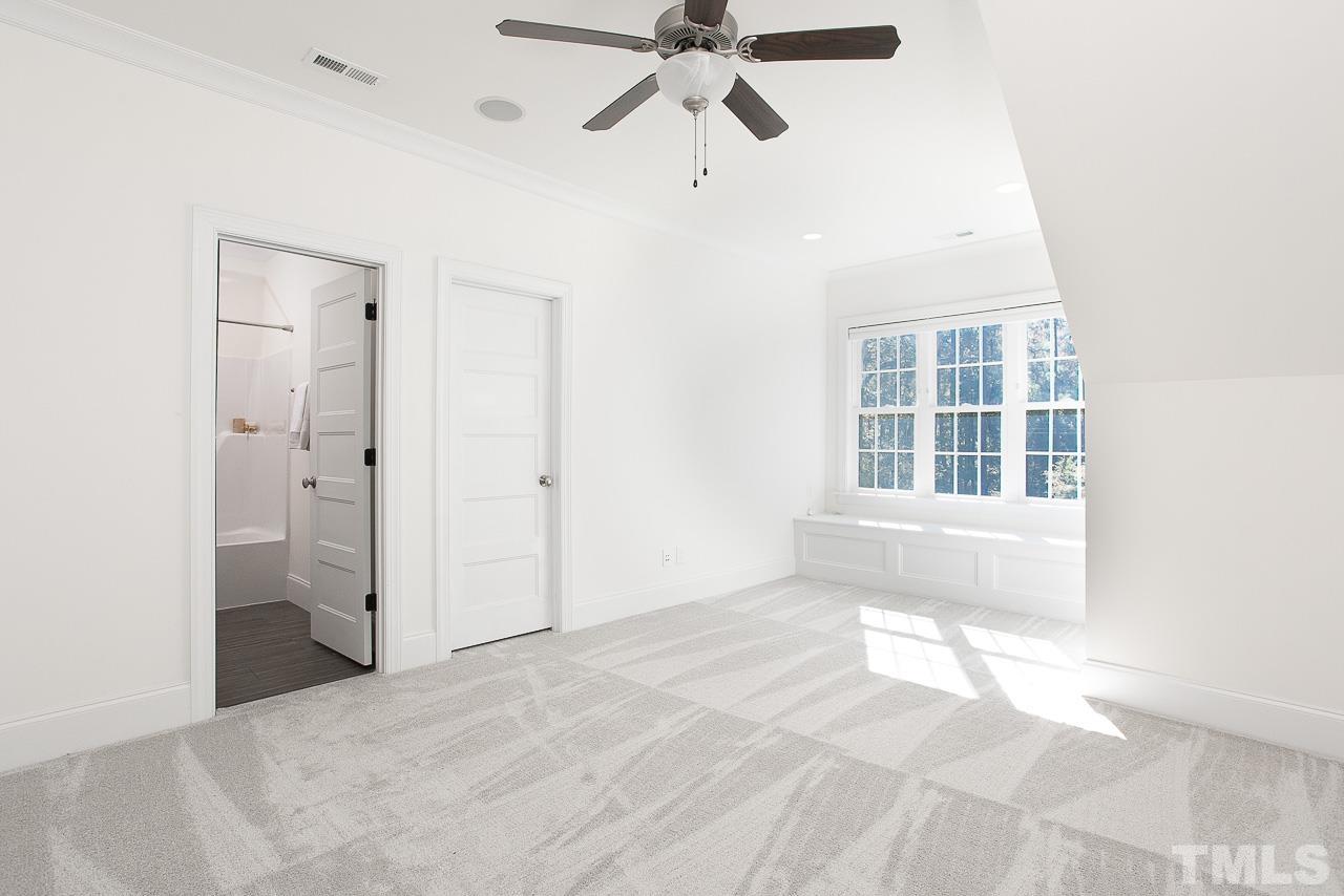 8087 Wake Road Durham, NC 27713 - Photo 22 of 30 a view of an empty room with a window