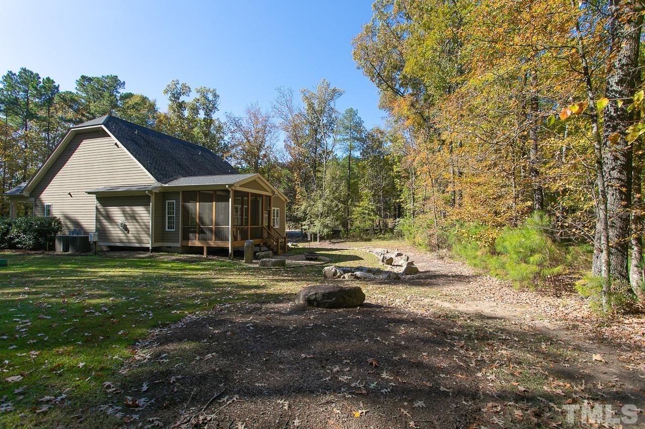 8087 Wake Road Durham, NC 27713 - Photo 27 of 30 a front view of a house with a yard