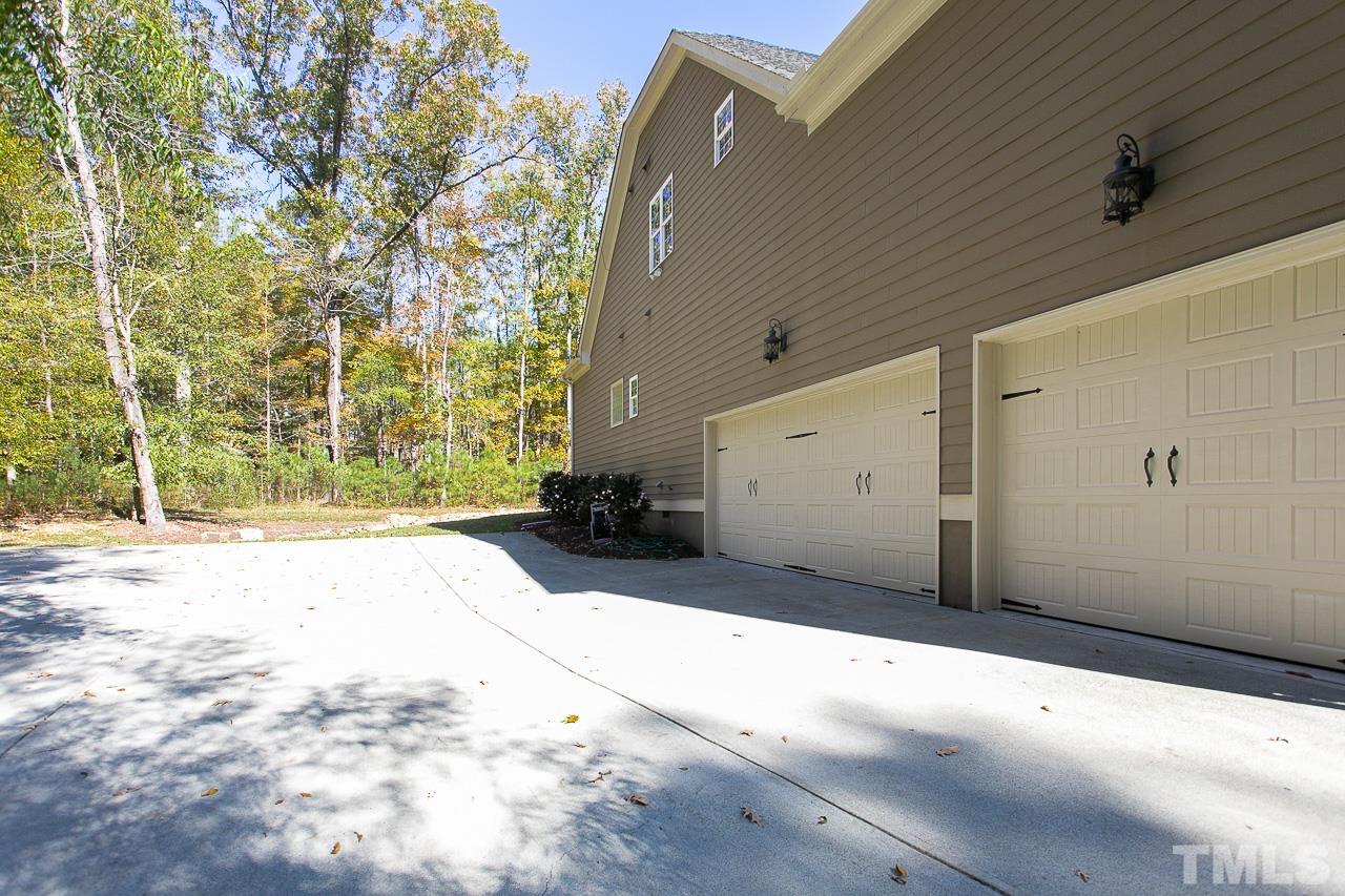 8087 Wake Road Durham, NC 27713 - Photo 28 of 30 a view of a backyard of a house