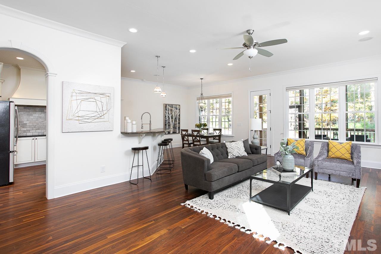 8087 Wake Road Durham, NC 27713 - Photo 6 of 30 a living room with furniture and wooden floor