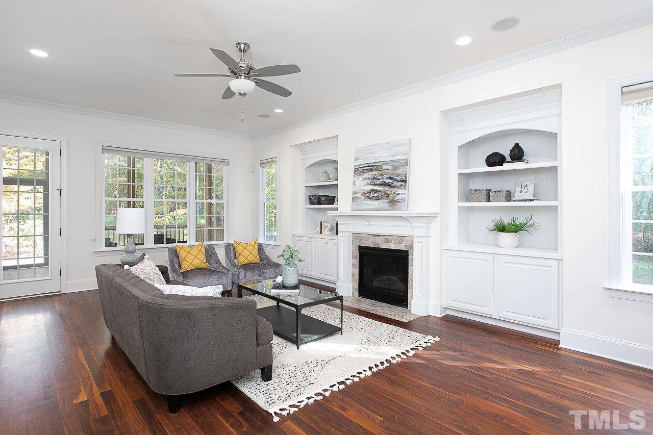 8087 Wake Road Durham, NC 27713 - Photo 7 of 30 a living room with furniture and a fireplace