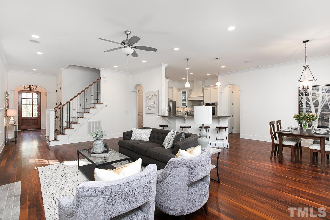 8087 Wake Road Durham, NC 27713 - Photo 8 of 30 a living room with furniture and wooden floor