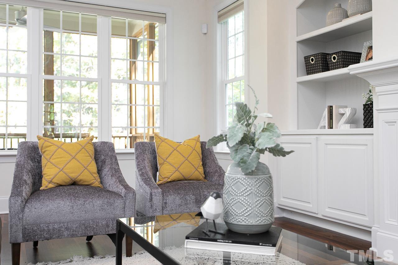 8087 Wake Road Durham, NC 27713 - Photo 9 of 30 a living room with furniture and a potted plant