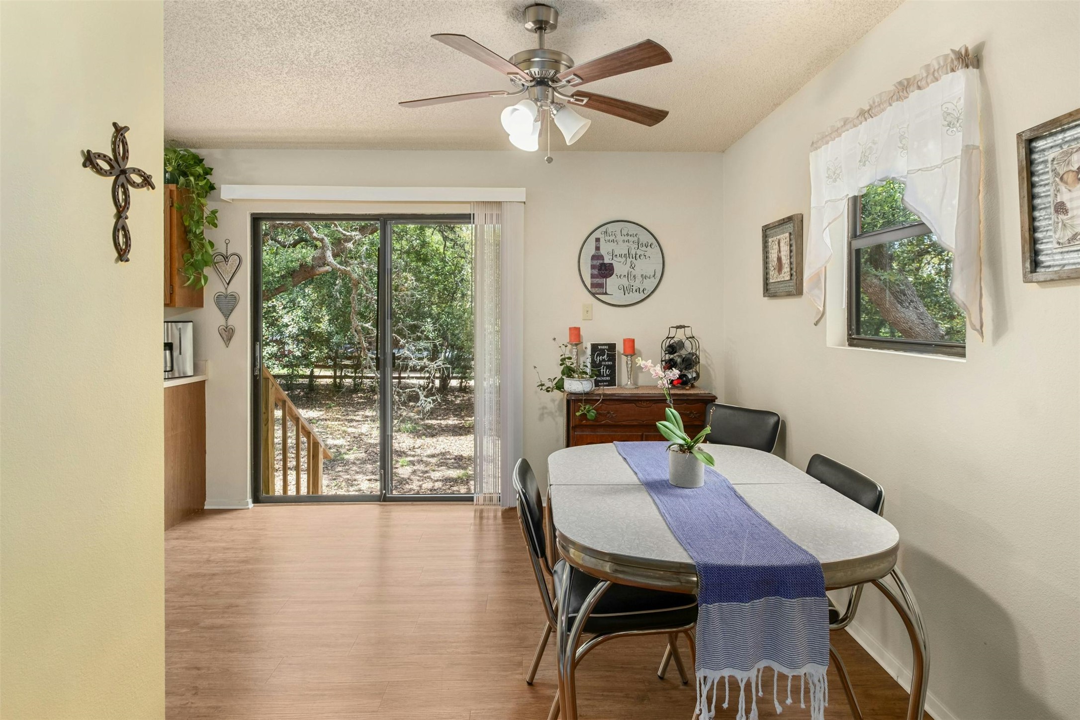 3805 Lone Man Mountain Road Wimberley, TX 78676 - Photo 11 of 19 a view of a dining room with furniture window and wooden floor