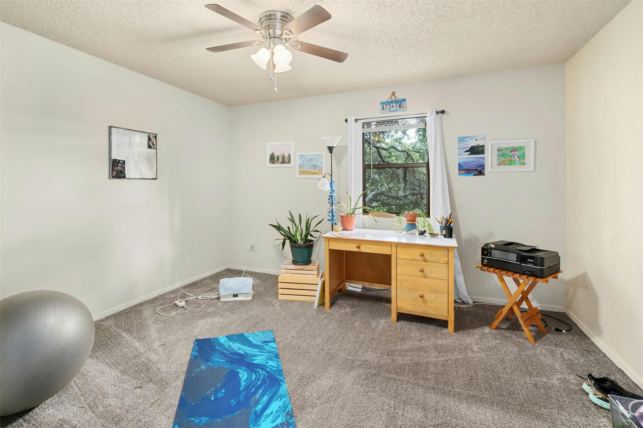 3805 Lone Man Mountain Road Wimberley, TX 78676 - Photo 15 of 19 a view of a workspace with furniture and a window