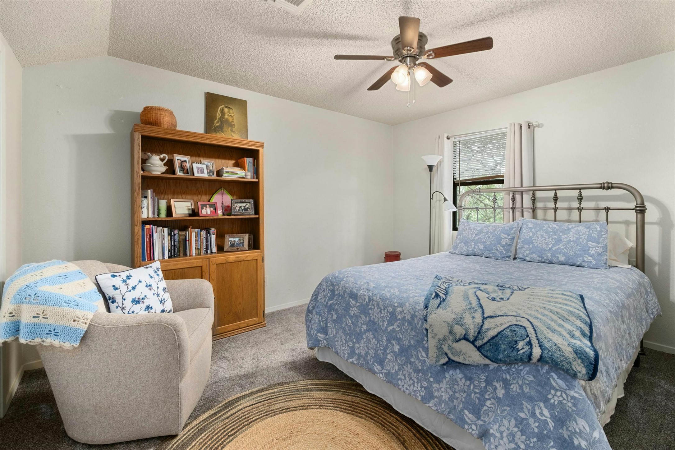 3805 Lone Man Mountain Road Wimberley, TX 78676 - Photo 16 of 19 a bedroom with a bed and a couch