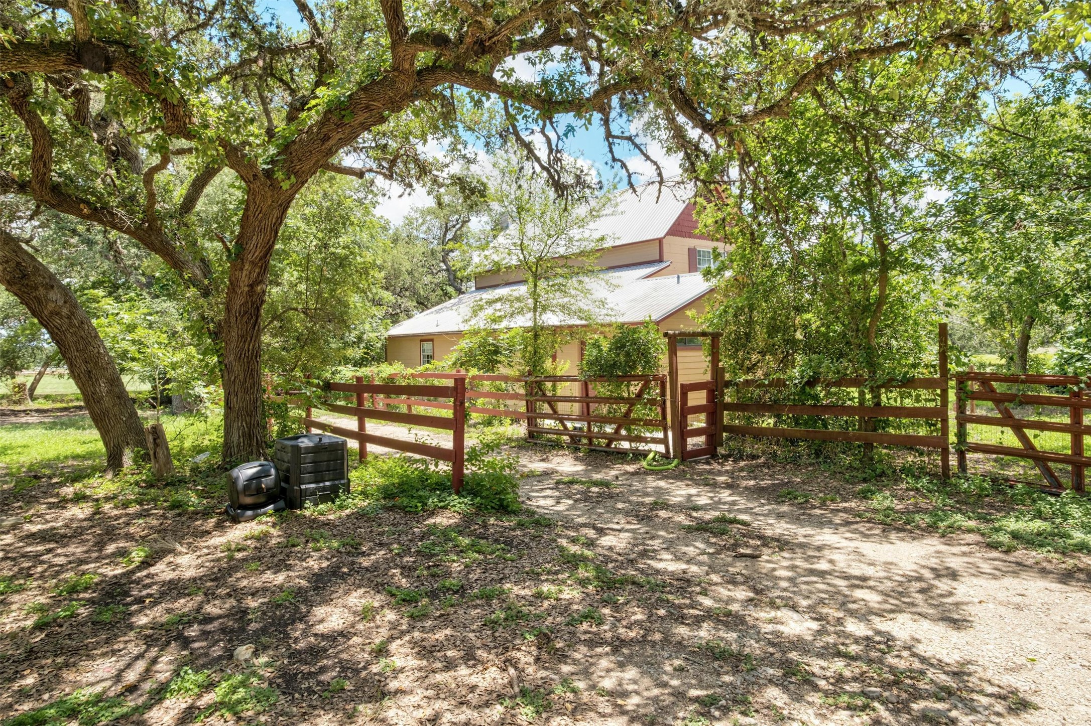 3805 Lone Man Mountain Road Wimberley, TX 78676 - Photo 2 of 19 a view of a park with large trees