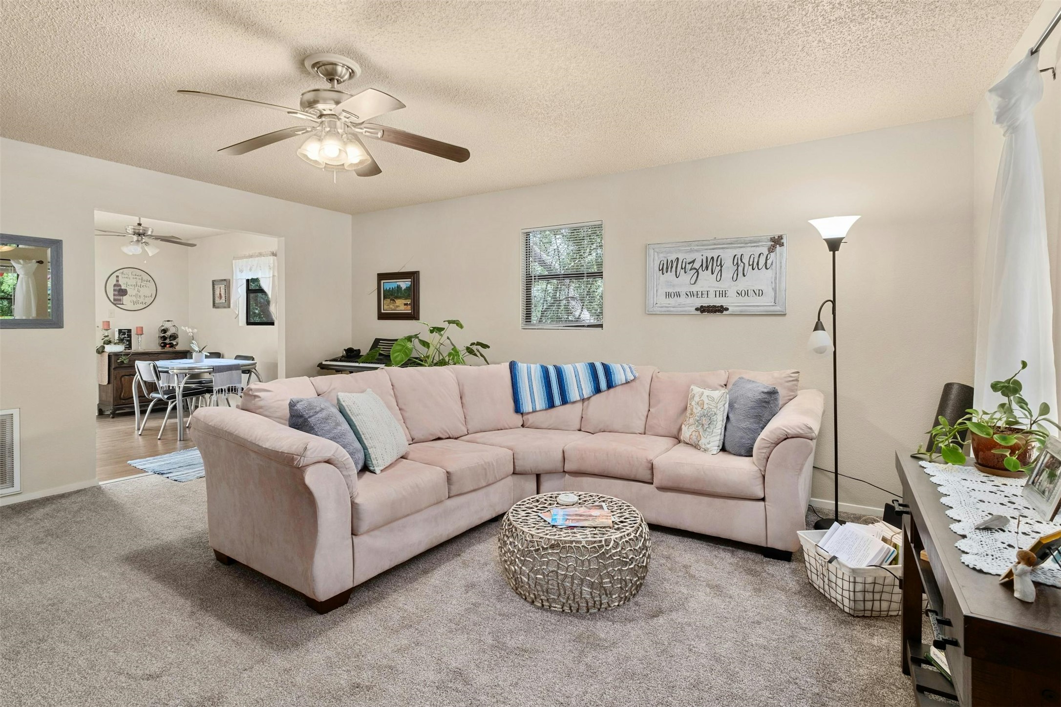 3805 Lone Man Mountain Road Wimberley, TX 78676 - Photo 5 of 19 a living room with furniture and a chandelier