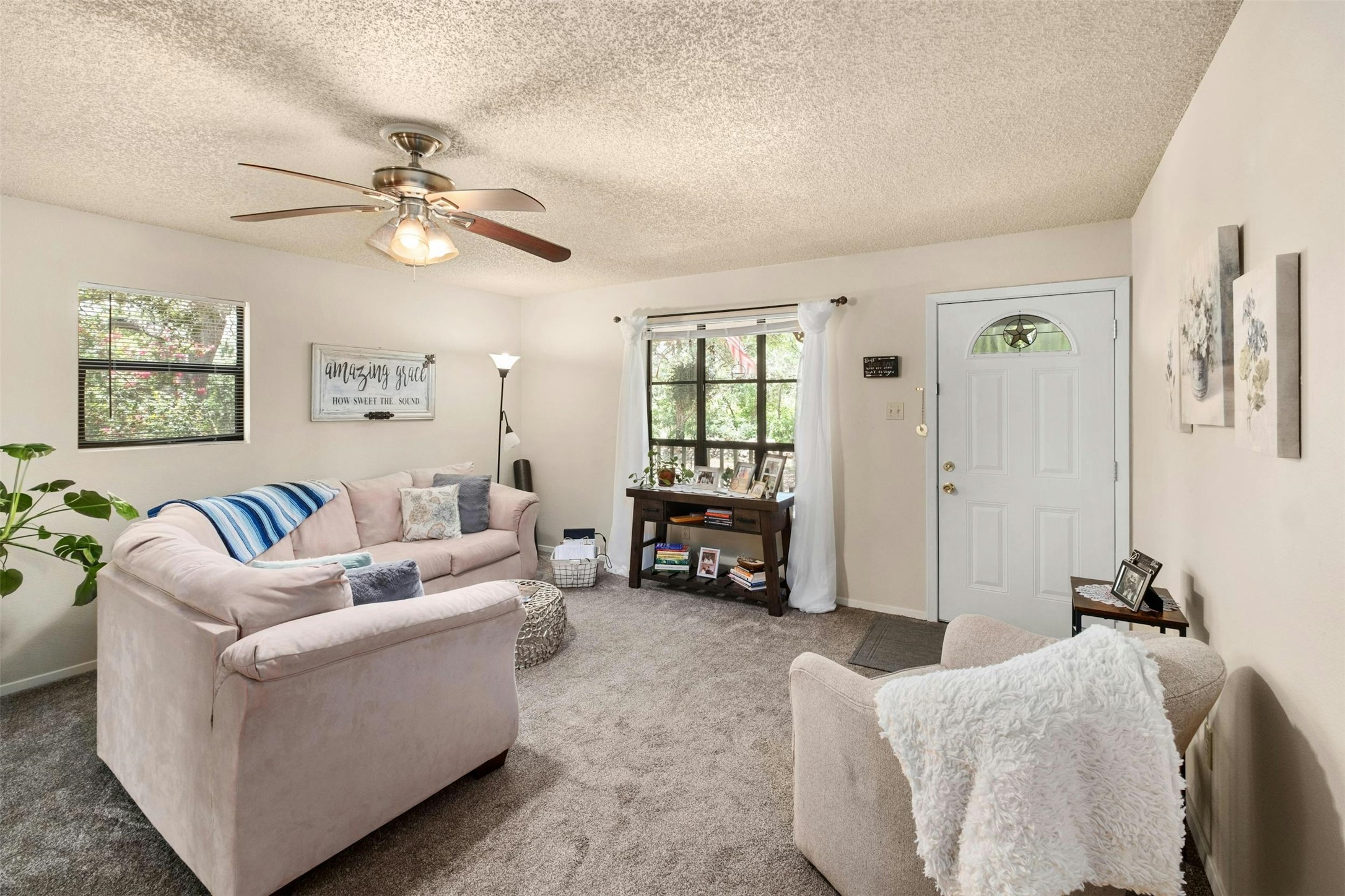 3805 Lone Man Mountain Road Wimberley, TX 78676 - Photo 6 of 19 a living room with furniture and a large window