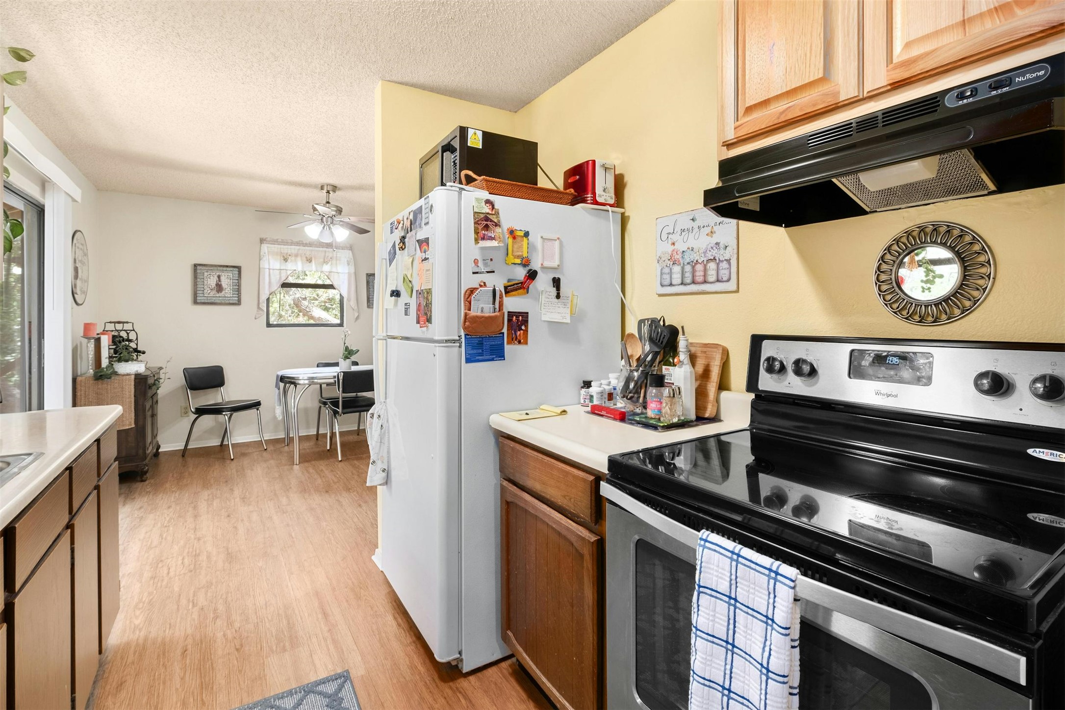 3805 Lone Man Mountain Road Wimberley, TX 78676 - Photo 9 of 19 a kitchen with a stove and a microwave