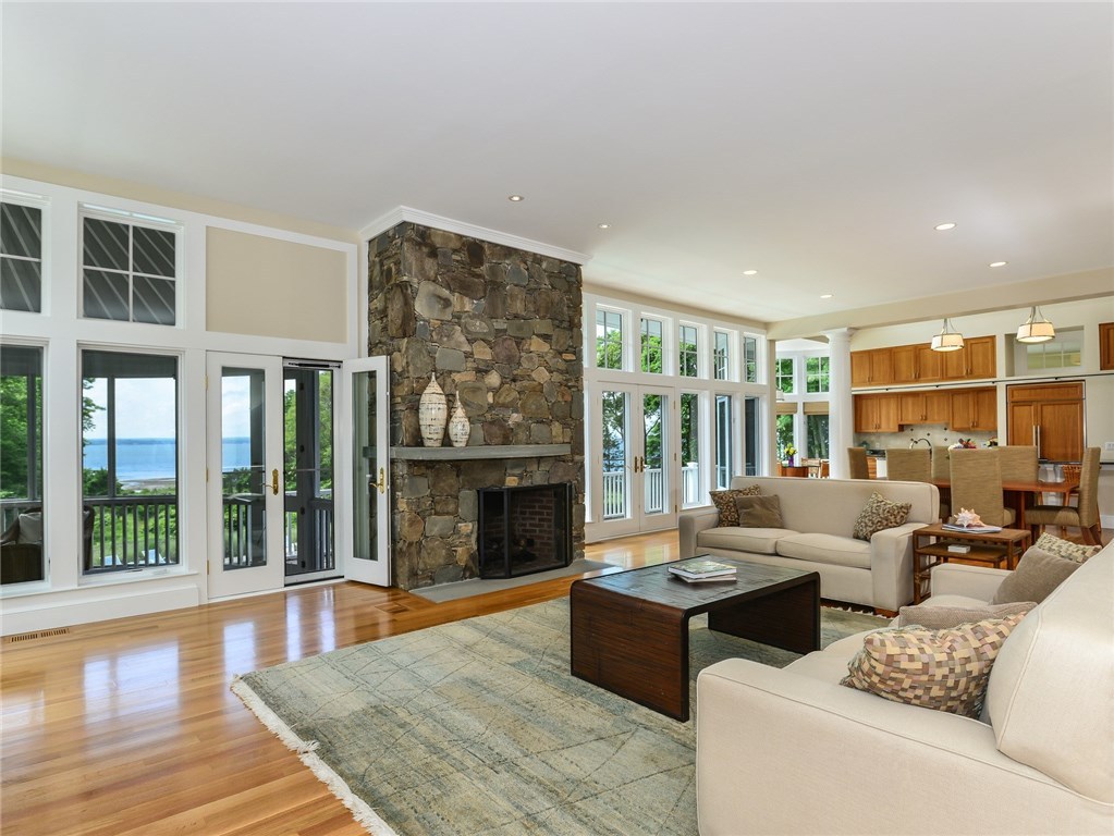1173 North Main Road Jamestown, RI 02835 - Photo 14 of 40 Living Room Is Open to Dining & Kitchen Area and Opens to Sunroom and Deck
