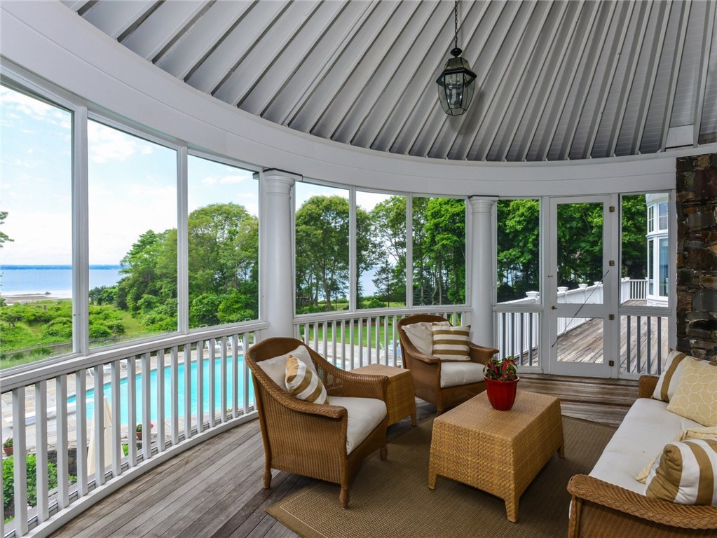 1173 North Main Road Jamestown, RI 02835 - Photo 15 of 40 Sunroom opens to mid-level deck and covered porch