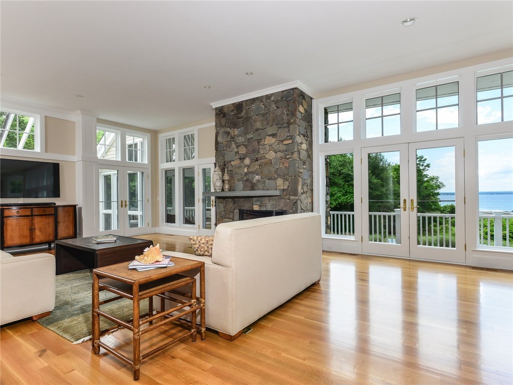 1173 North Main Road Jamestown, RI 02835 - Photo 16 of 40 Living Area/Great Room is Warm by a Stone Fireplace