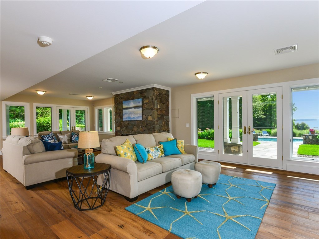 1173 North Main Road Jamestown, RI 02835 - Photo 31 of 40 Family Room on Lower Walk-Out Level open to Pool and Patio
