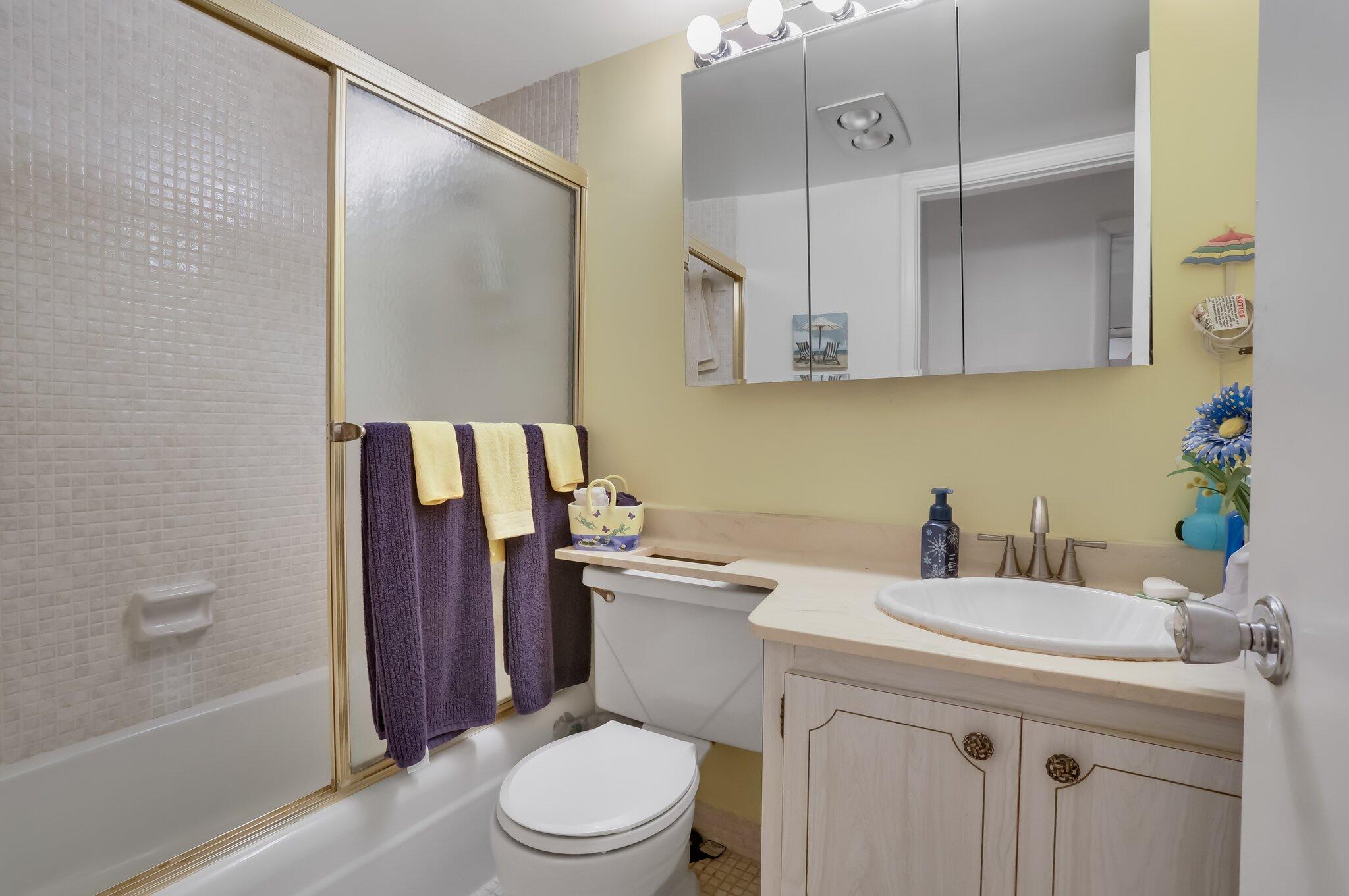 3401 Spanish Trail, Unit 151 Delray Beach, FL 33483 - Photo 20 of 20 a bathroom with a sink a toilet and shower