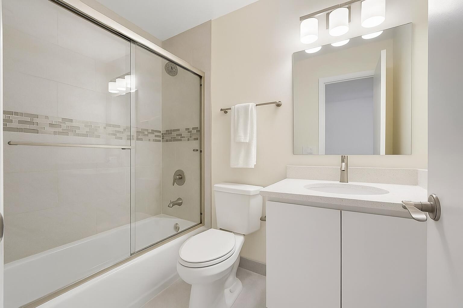 3401 Spanish Trail, Unit 151 Delray Beach, FL 33483 - Photo 6 of 20 a bathroom with a sink a toilet and shower