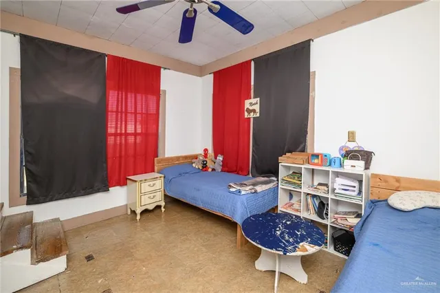 a bedroom with furniture and a window