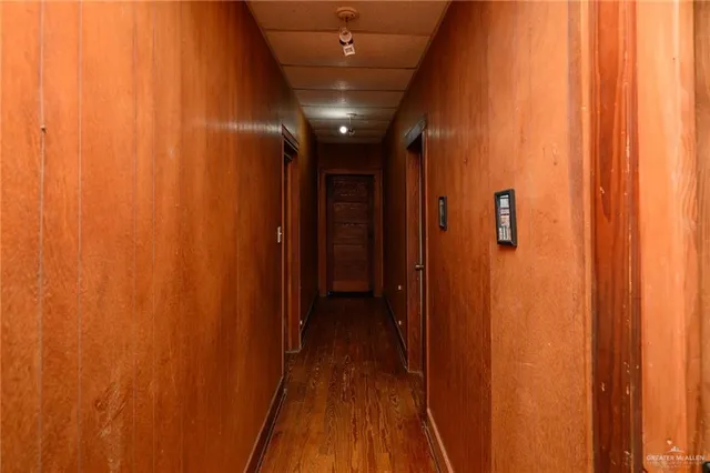 a view of hallway with wooden floor