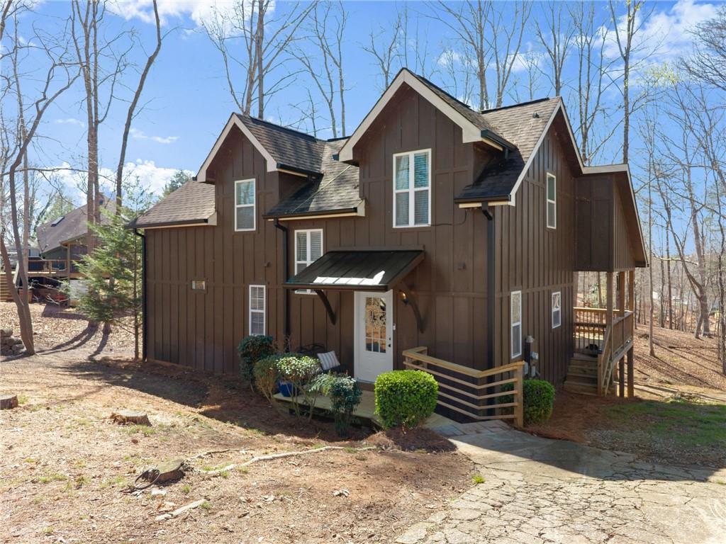 a front view of a house with garden