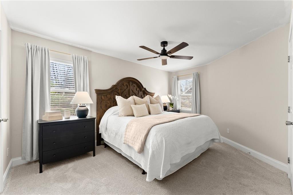 3211 The Trail Road Gainesville, GA 30501 - Photo 14 of 35 a bedroom with a bed and a large window