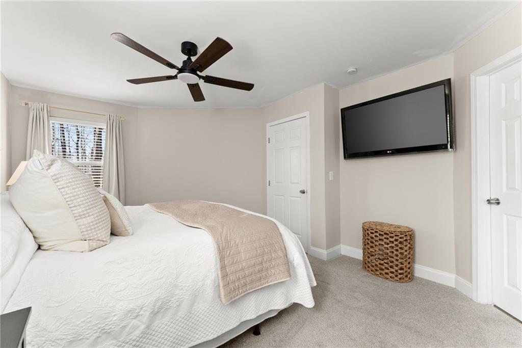 3211 The Trail Road Gainesville, GA 30501 - Photo 15 of 35 a bedroom with a bed and a flat screen tv