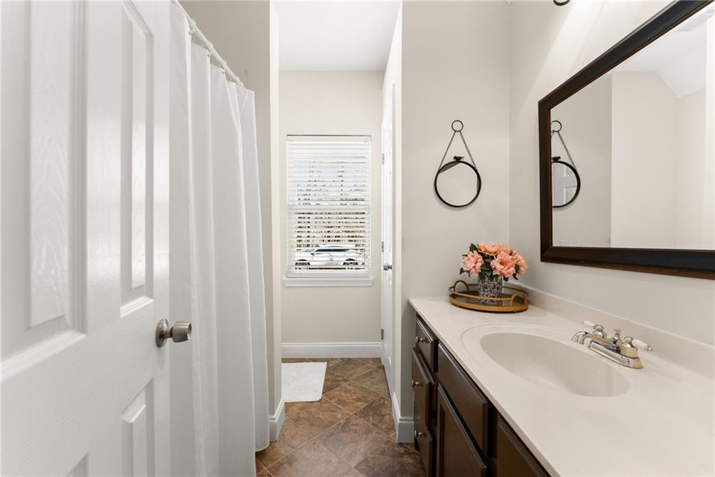 3211 The Trail Road Gainesville, GA 30501 - Photo 22 of 35 a bathroom with a sink vanity and tub