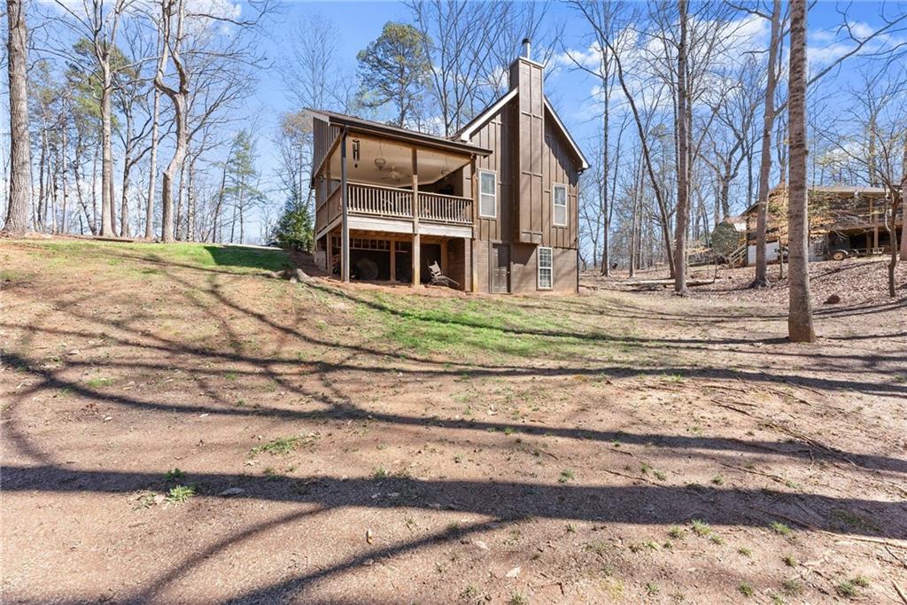 3211 The Trail Road Gainesville, GA 30501 - Photo 29 of 35 a front view of a house with a yard