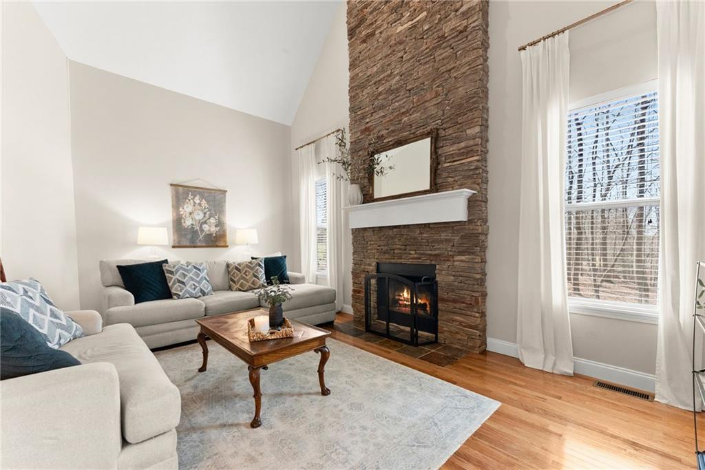 3211 The Trail Road Gainesville, GA 30501 - Photo 3 of 35 a living room with furniture and a fireplace