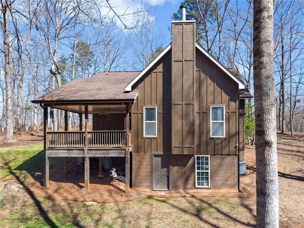 3211 The Trail Road Gainesville, GA 30501 - Photo 32 of 35 a view of a house with a yard and wooden deck