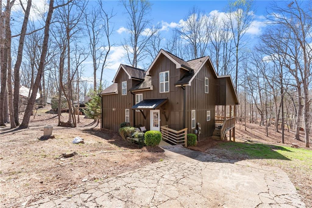 3211 The Trail Road Gainesville, GA 30501 - Photo 33 of 35 a view of a house with a yard covered in snow