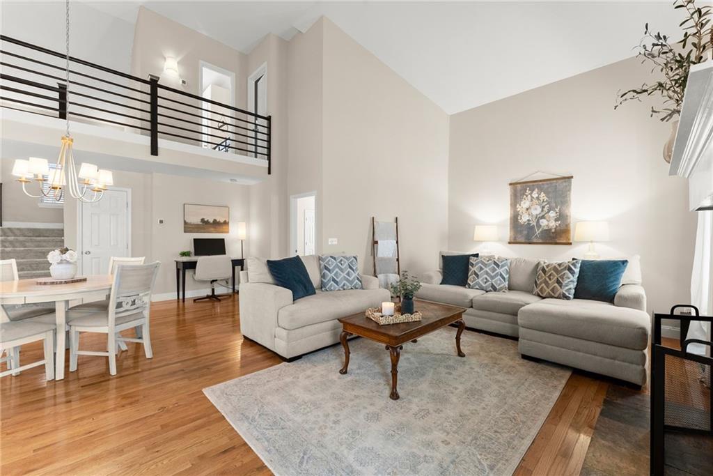 3211 The Trail Road Gainesville, GA 30501 - Photo 5 of 35 a living room with furniture and wooden floor