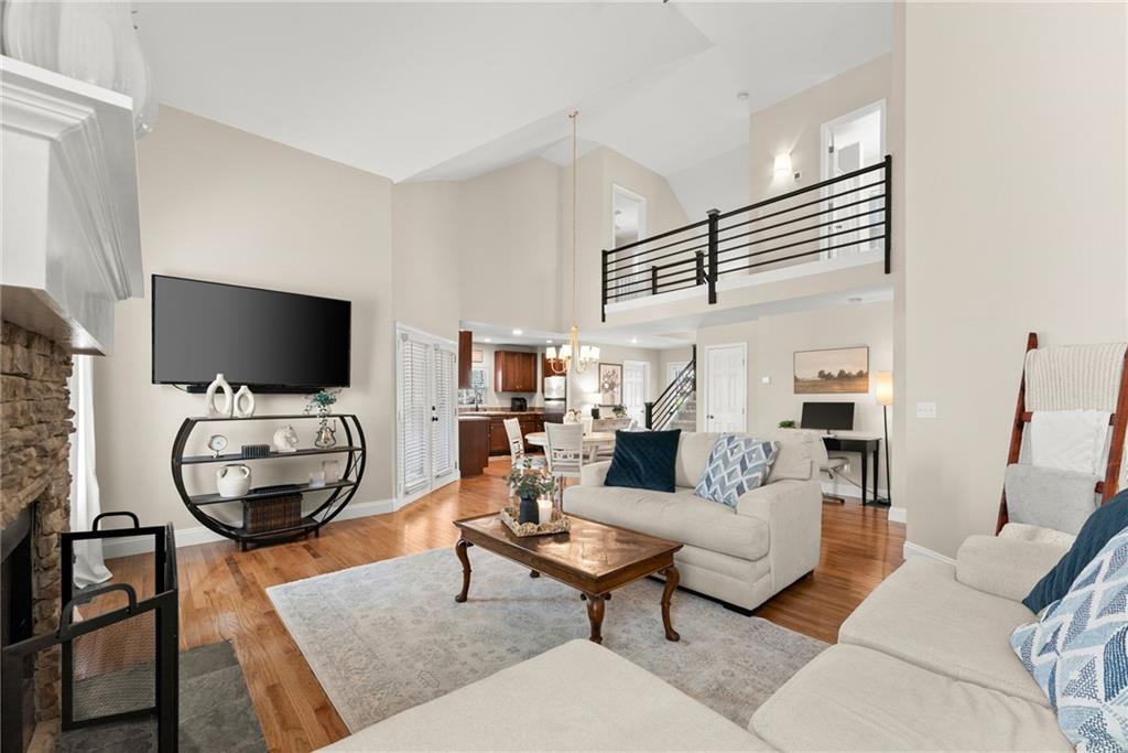 3211 The Trail Road Gainesville, GA 30501 - Photo 6 of 35 a living room with furniture and a flat screen tv