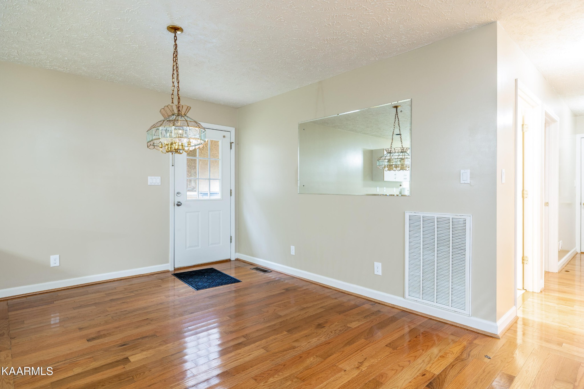 914 Wears Valley Road Townsend, TN 37882 - Photo 13 of 48 a view of an empty room with wooden floor and a window