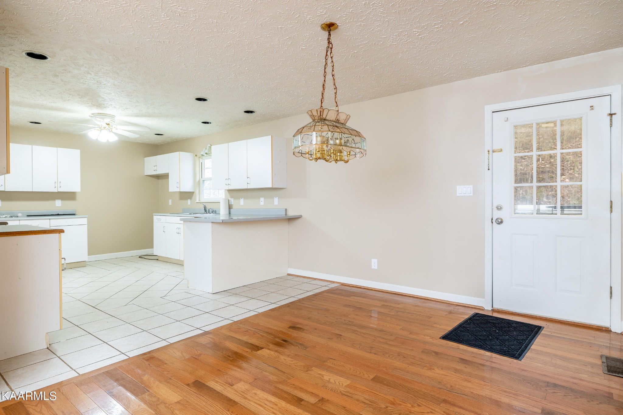 914 Wears Valley Road Townsend, TN 37882 - Photo 14 of 48 a view of a kitchen with a sink and dishwasher wooden floor
