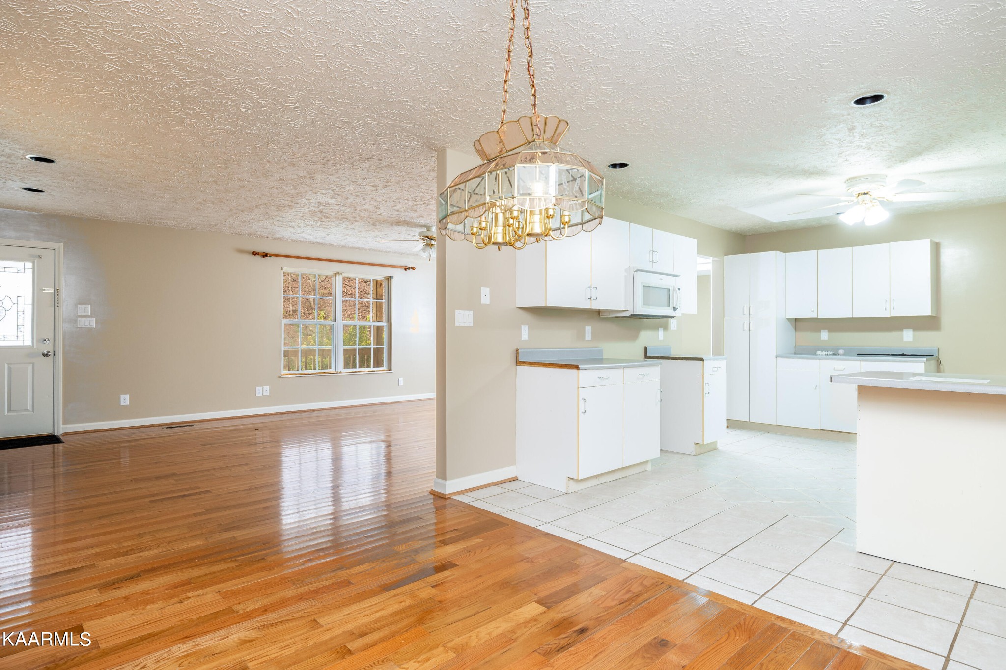 914 Wears Valley Road Townsend, TN 37882 - Photo 15 of 48 a kitchen with granite countertop a stove a sink and a refrigerator