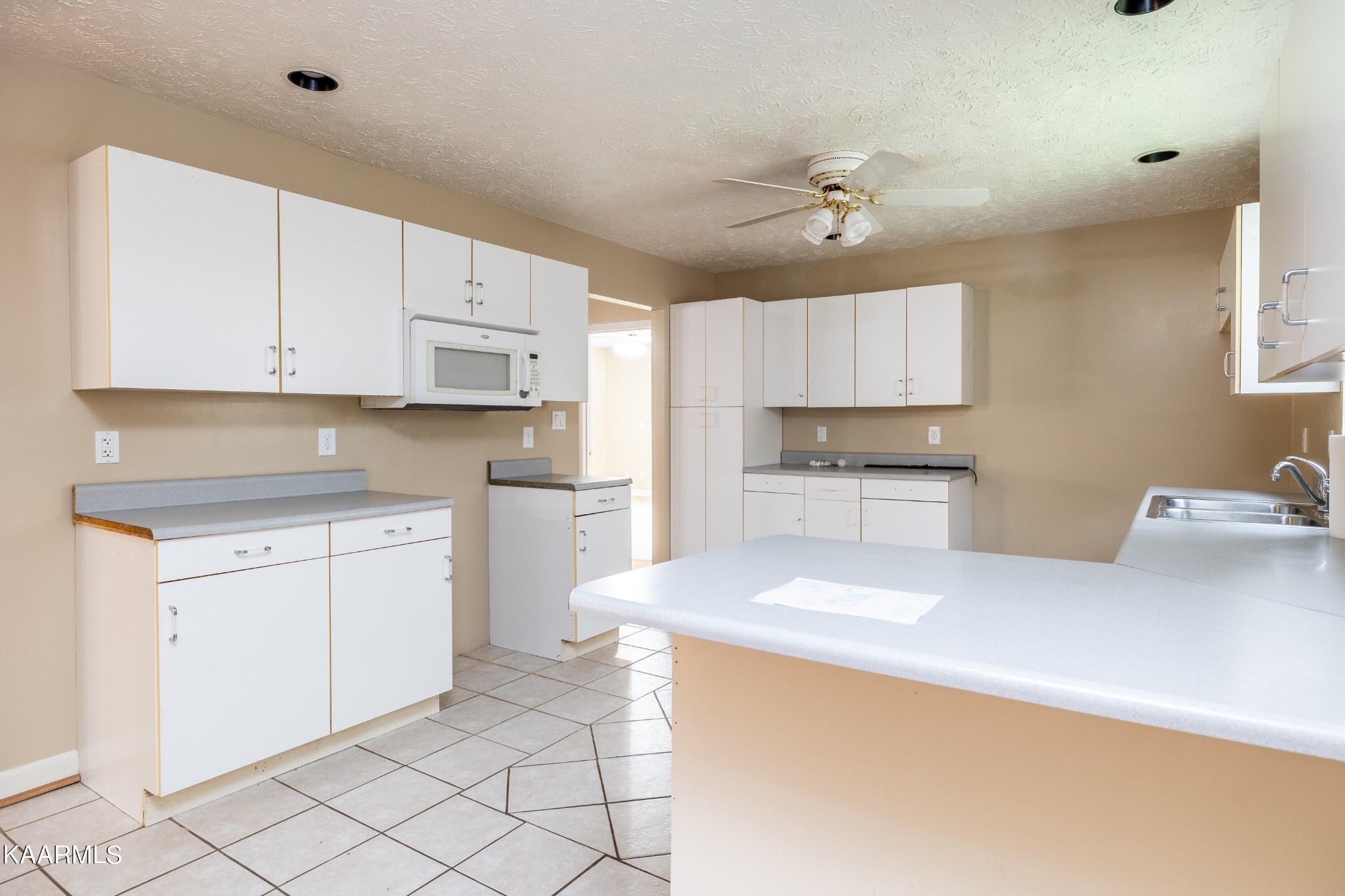 914 Wears Valley Road Townsend, TN 37882 - Photo 16 of 48 a kitchen with granite countertop white cabinets white stainless steel appliances with a sink and dishwasher