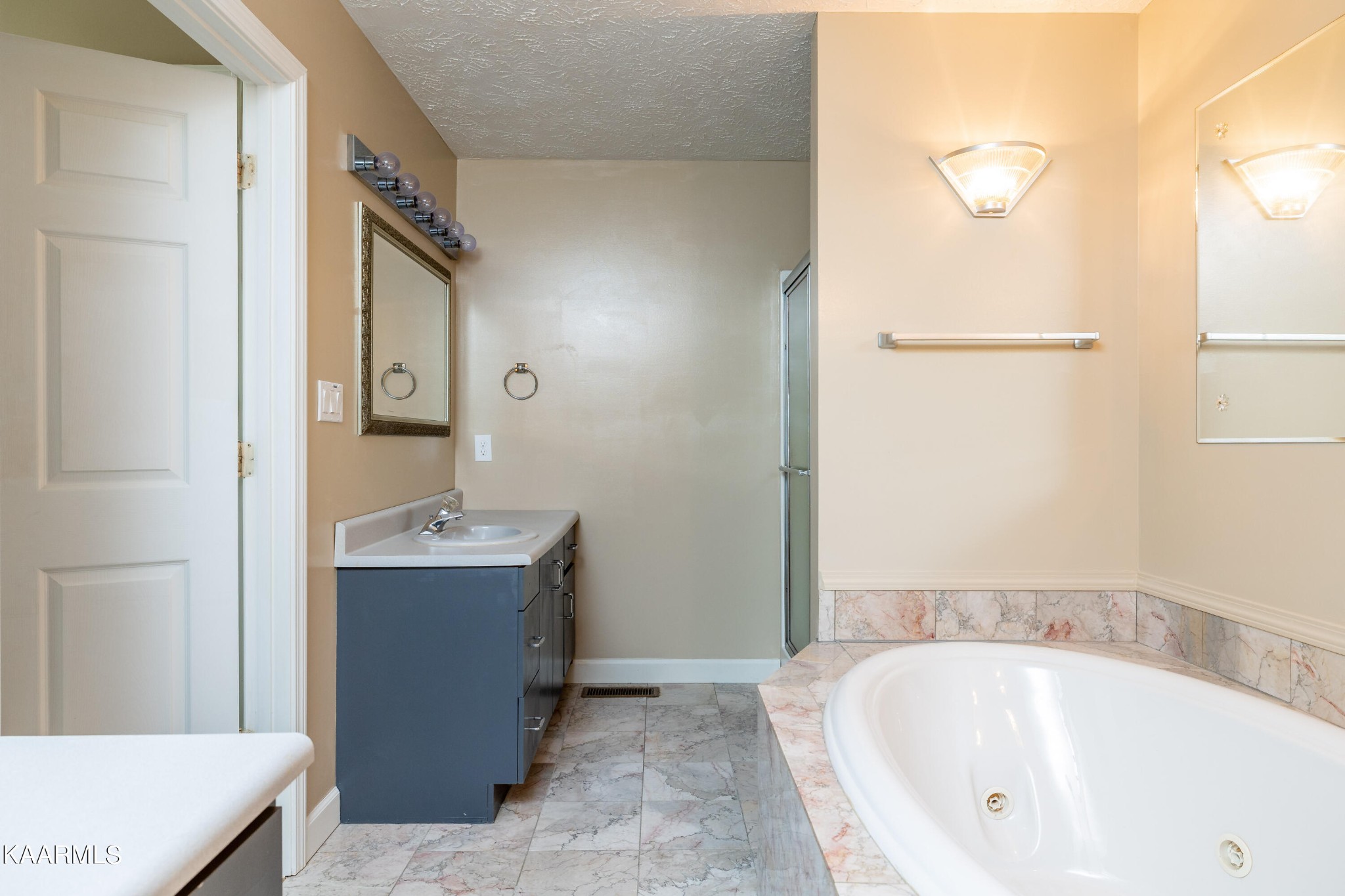 914 Wears Valley Road Townsend, TN 37882 - Photo 30 of 48 a bathroom with a tub sink and mirror