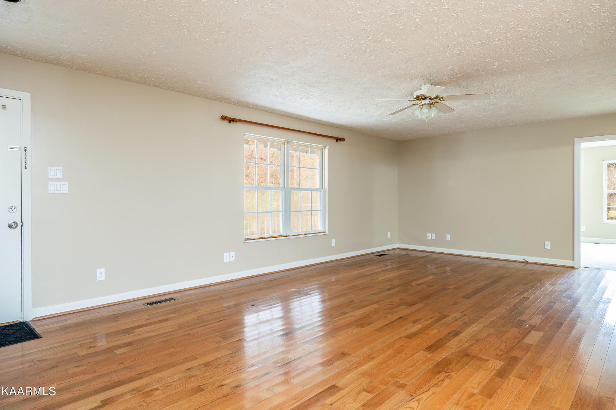 914 Wears Valley Road Townsend, TN 37882 - Photo 10 of 48 wooden floor in an empty room with a window