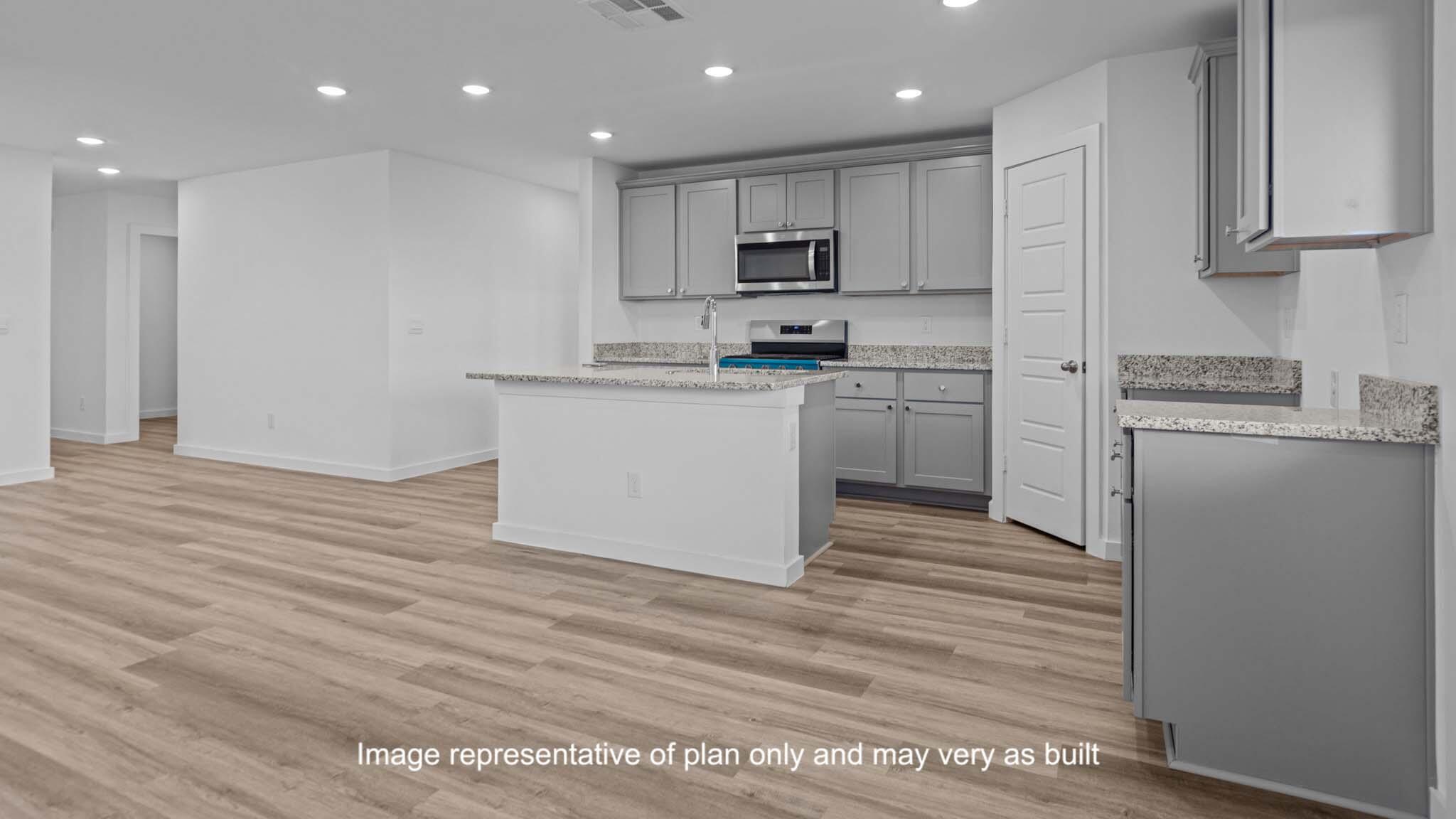 7444 9th Street Lubbock, TX 79416 - Photo 5 of 24 a kitchen with a refrigerator and a stove top oven